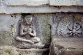 Fig. 9.  Female devotee with pendant earrings. Stone relief. Chabahil stupa, Kathmandu, 7th-8th cent. &copy; Amy Heller