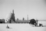 Creswell photographing on the rooftop of the Mosque of Ibn Tulun, Cairo, in 1960., Photo by: Dr Christel Kessler. &copy; Ashmolean Museum, University of Oxford