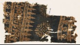 Textile fragment with Arabic-style script, rosettes, and stylized trees or foliage