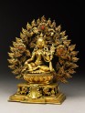 Seated figure of a female deity, possibly Tara, with a mandorla of flames