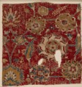 Mughal carpet fragment with scrolling vines and blossoms