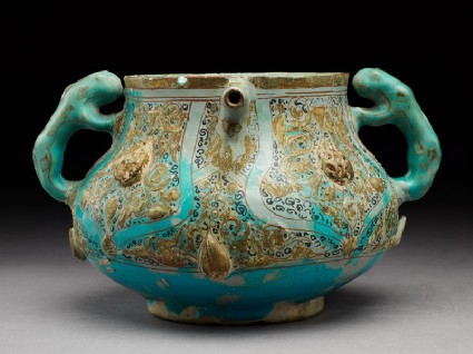 Lidded jar surmounted by an eagle, with handles in the form of lionsside