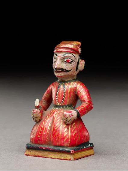 Pawn chess-piece in the form of a kneeling manside