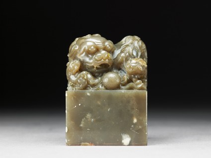 Jade seal surmounted by lion-dog with four pups and ballside