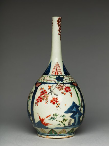 Bottle with plants growing from rocksside