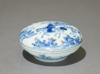 Blue-and-white ink box with man riding a horseoblique