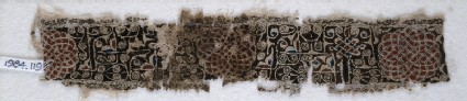 Textile fragment with interlacing scrolls and knotted patternfront