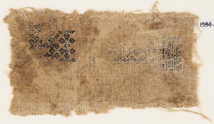 Textile fragment with linked quatrefoils and chevronsfront