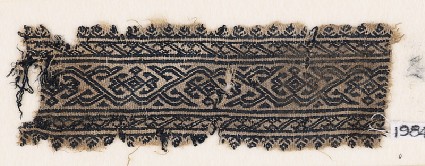 Textile fragment with vine and diamond-shaped flowersfront