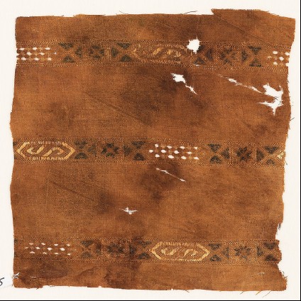 Textile fragment with three bands with hexagonal cartouchesfront