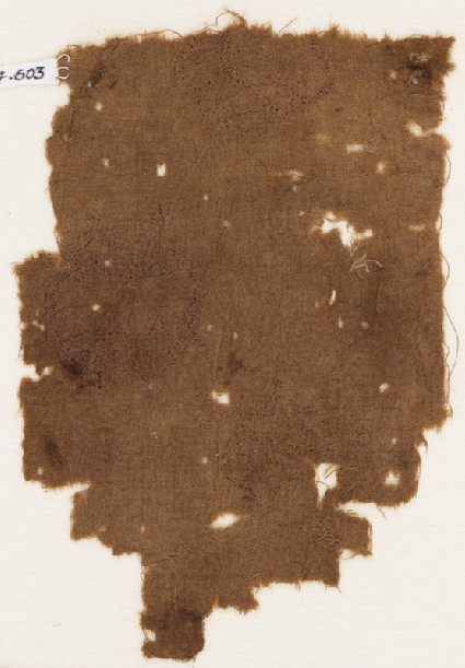 Textile fragment with traces of circles with tendrilsfront