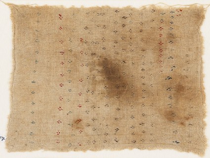 Textile fragment with parallel rows of diamond-shapesfront