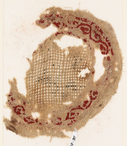 Roundel textile fragment with vine borderfront