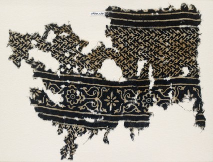 Textile fragment with linked chevrons and flowers, possibly from a garmentfront
