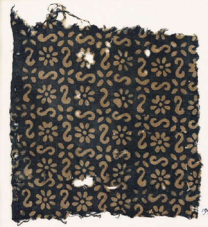Textile fragment with S-shapes, rosettes, and flowersfront