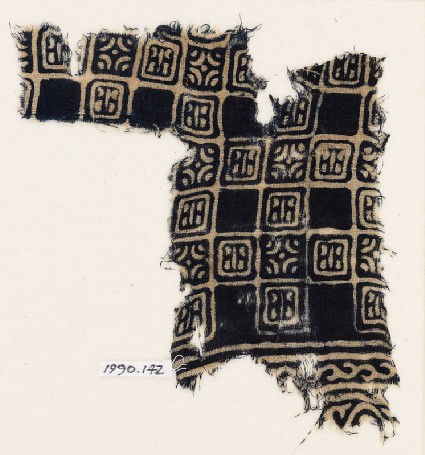 Textile fragment with linked squares, stylized flower-heads, and lines with dotsfront