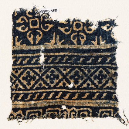 Textile fragment with diamond-shapes, S-shapes, and quatrefoilsfront