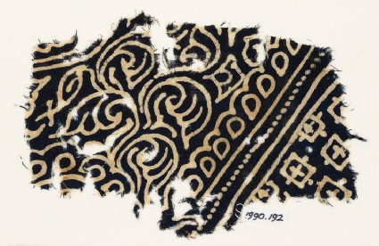 Textile fragment with swirling tendrils, tear-drops, and squaresfront