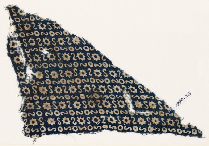 Textile fragment with S-shapes, circles, and starsfront