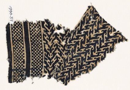 Textile fragment with linked chevrons, trefoils, and bands of dotsfront