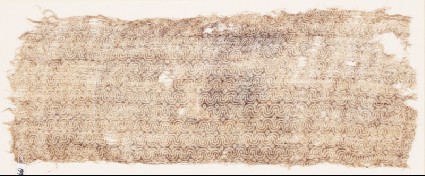 Textile fragment with wavy lines and dotsfront