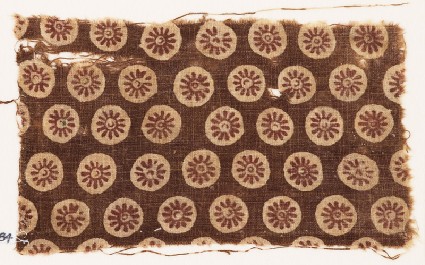 Textile fragment with rosettes in circlesfront