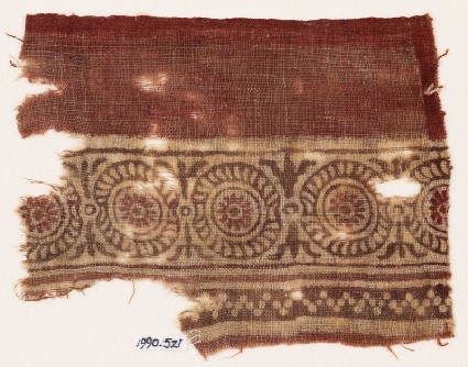 Textile fragment with rosettes in dotted framesfront
