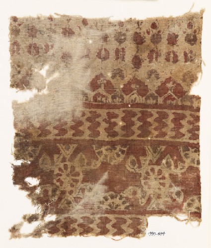 Textile fragment with rosettes, chevrons, and possibly floral designsfront