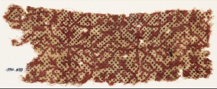 Textile fragment with interlacing tendrils and dotsfront