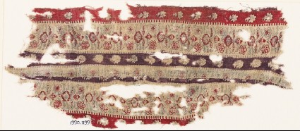 Textile fragment with bands of flowersfront