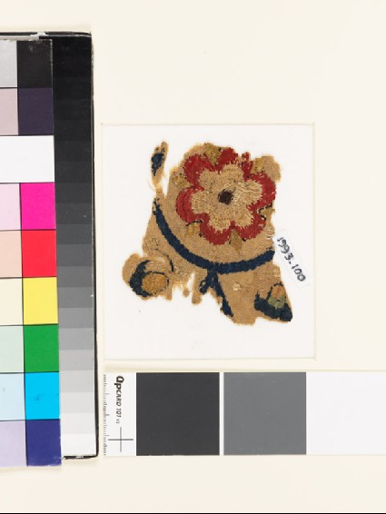 Textile fragment with rosette and remains of buds or foliagefront