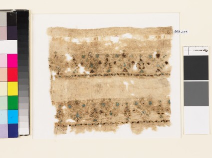 Textile fragment with stylized plants and leavesfront