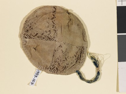 Textile fragment with geometric pattern, probably from a jar coverfront