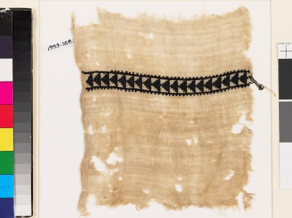 Textile fragment with triangles and crossesfront