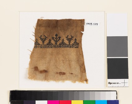 Textile fragment with stylized birds and treesfront