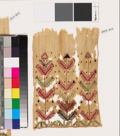 Textile fragment with stylized plants and chevronsfront