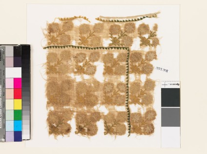 Textile fragment with stylized floral shapesfront