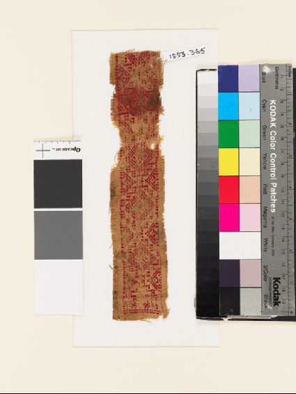 Textile fragment with band of stepped diamond-shapes and trianglesfront