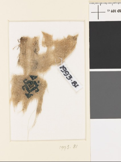 Textile fragment with heart-shaped medallions, triangles, and hooksfront