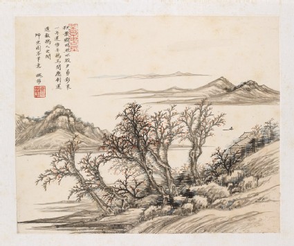 Red leaves on trees by a riverfront