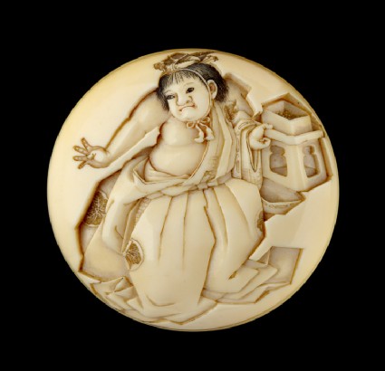 Manjū netsuke depicting a boy throwing beans at the Setsubun festivalfront