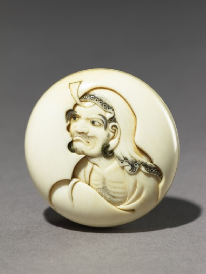 Manjū netsuke depicting Daruma playing the kamifuki gamefront
