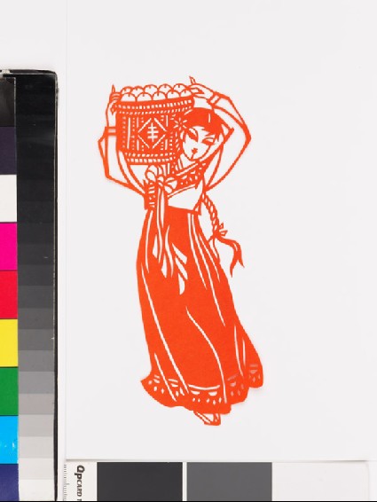 Girl in national minority costume carrying a basket of applesfront