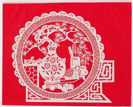 Flowers in a vase and antiquesfront