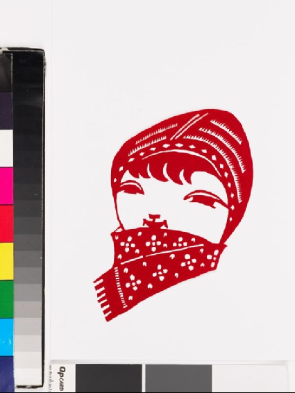 National minority child wearing hat and a scarffront