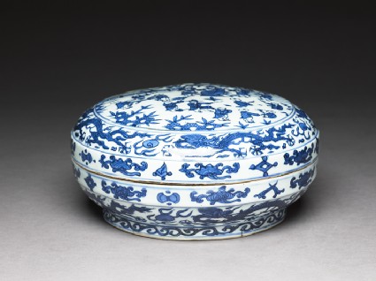 Blue-and-white box with figures in a gardenoblique