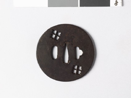 Lenticular tsuba with two karahana, or Chinese flowersfront