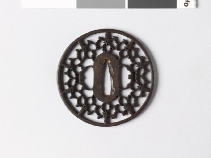 Round tsuba with myōga, or ginger shoots, and kiri, or paulownia leavesfront