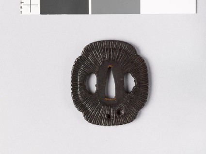 Mokkō-shaped tsuba with chrysanthemum floretsfront