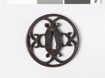 Round tsuba with double volutesfront